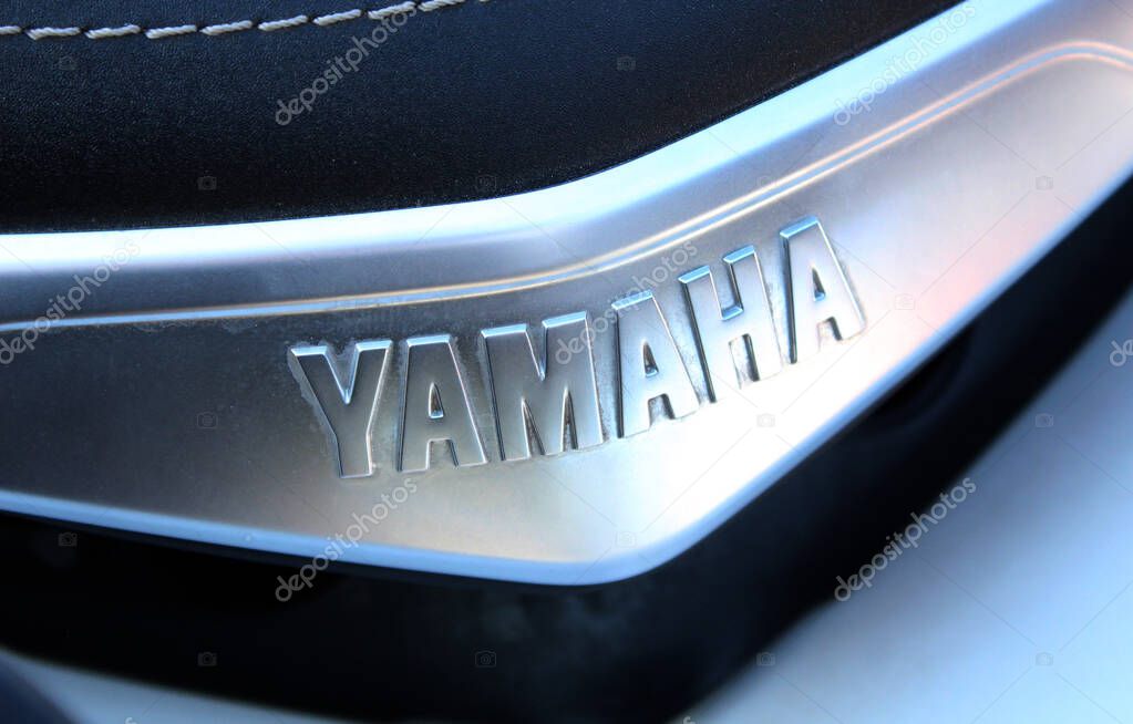 Vinnytsia, Ukraine; September 06, 2025. Close-up Yamaha nameplate with embossed silver letters on metallic surface. Close up Yamaha logo. Yamaha Motor Company logo and emblem.