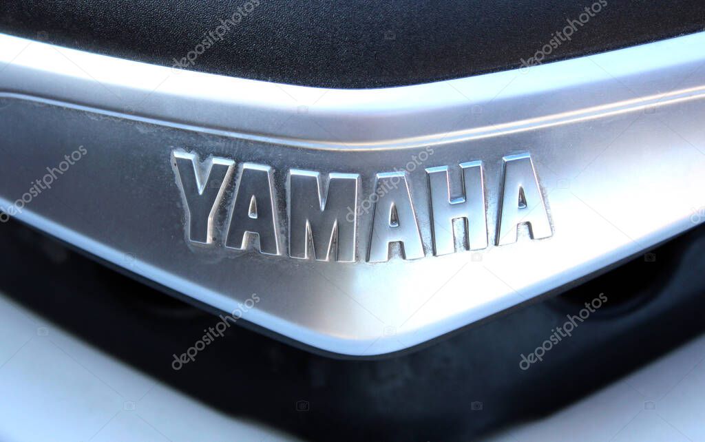 Vinnytsia, Ukraine; September 06, 2025. Close-up Yamaha nameplate with embossed silver letters on metallic surface. Close up Yamaha logo. Yamaha Motor Company logo and emblem.