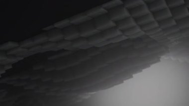 3D şekiller kusursuz bir video gibi hareket ediyor. Karanlık, pürüzsüz, hareketsiz karelerin arka planı. Küpler yukarı aşağı hareket eder ve büyüleyici bir zemin oluşturur. Parlak renk ve pürüzsüz animasyon 3D sanat. 4K Çözünürlüğü