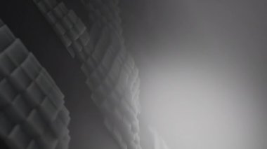 3D şekiller kusursuz bir video gibi hareket ediyor. Karanlık, pürüzsüz, hareketsiz karelerin arka planı. Küpler yukarı aşağı hareket eder ve büyüleyici bir zemin oluşturur. Parlak renk ve pürüzsüz animasyon 3D sanat. 4K Çözünürlüğü