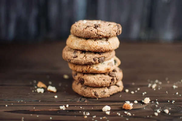a stack of chocolate biscuits and crumbs