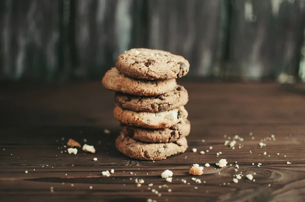 stack of chocolate biscuits and crumbs. Copy space.