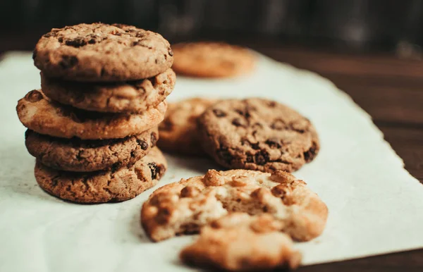 Tasty chocolate cookies on tray, closeup