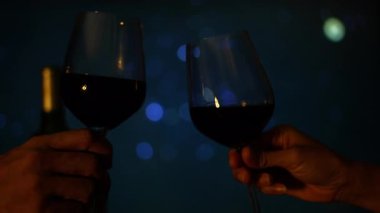 Clinking Wine Glasses In Evening Celebration, Wine glasses tap merrily in the cozy evening air, filled with clicking sounds, great for a heartwarming film clip or nature inspired cinematic promotion.