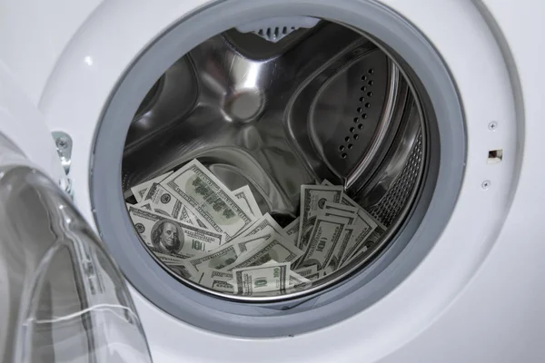 Money laundering concept. AML. Money in washing machine