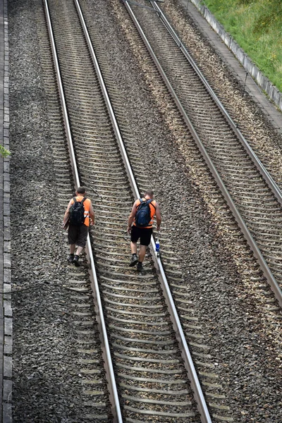 Two railway workers control railways.