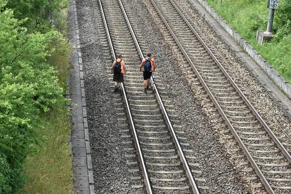 Two railway workers control railways.