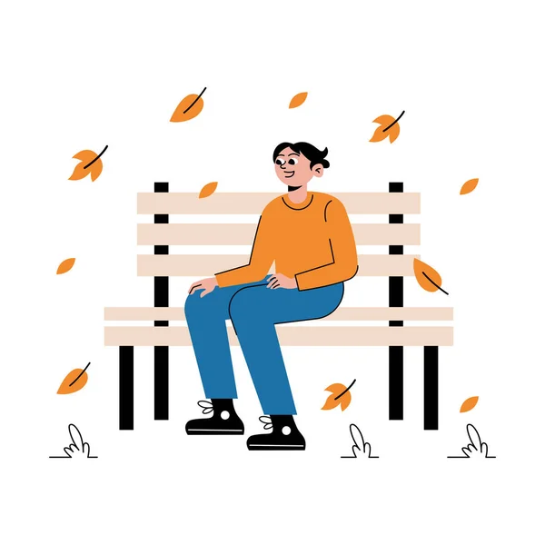 Sonbahar parkında bankta oturan çocuk