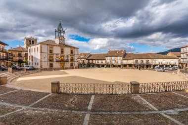 RIAZA, SEGOVIA, SPAIN - JUNE 16, 2020: Plaza Mayor de Riaza with the Town Hall, a place near the Ayllon mountains clipart