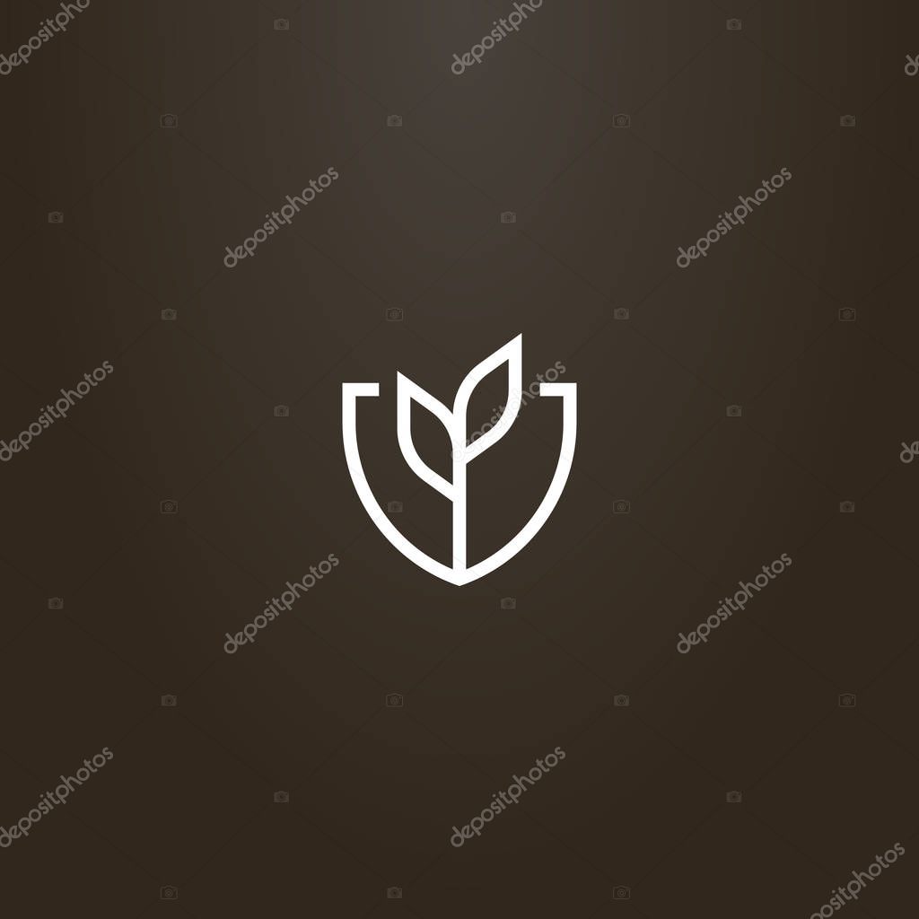 White sign on a black background. vector line art geometric sign of plant with two leaves in a shield shaped frame
