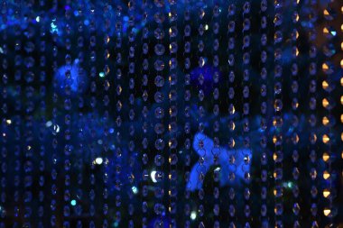 Mavi parlak çelenk şeffaf cam. Güzel Festival arka plan, sıçrama, doku.