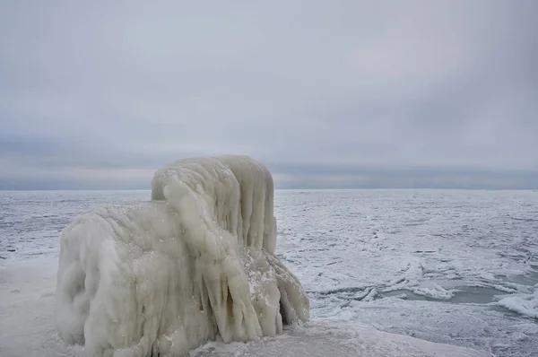 Frozen ice-covered sea and blocks of ice. Winter sea. Black Sea.