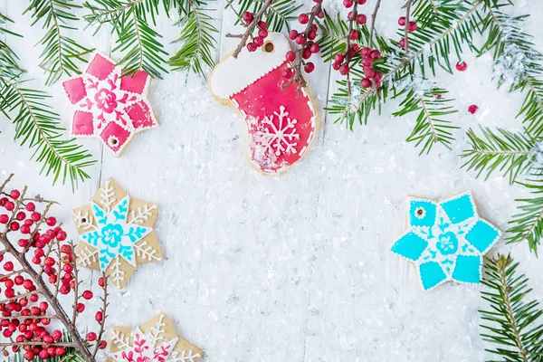 Christmas card, splash screen. Christmas tree and gingerbread on a light background. New year celebration and christmas concept