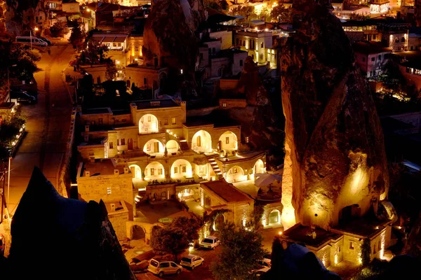 View of the night city of Goreme. Cappadocia night photo. Luminous cave hotels. Turkey.