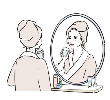 Aynanın karşısında durup dişlerini fırçalayan bornozlu bir kadın.