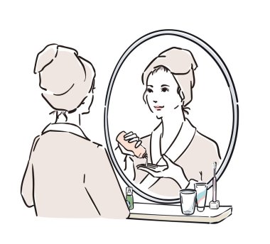 Aynanın önünde duran bornozlu kadınlar cilt bakımı