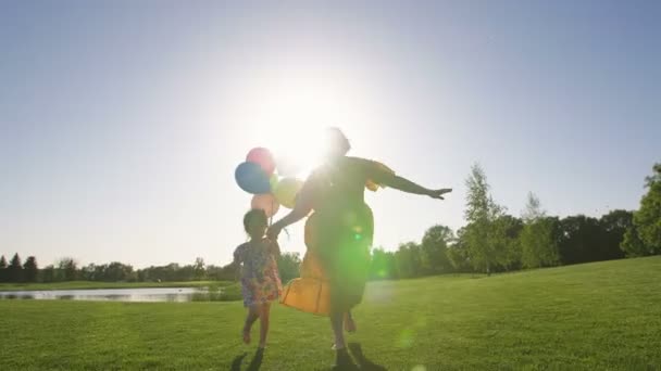 Mother Special Needs Toddler Daughter Holding Hands Running Together Green — Stock Video