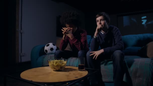 Teen friends rejoicing victory of soccer team — Stock Video