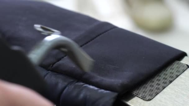 Cleaning of jacket sleeve using sprayer and dryer — Stock Video