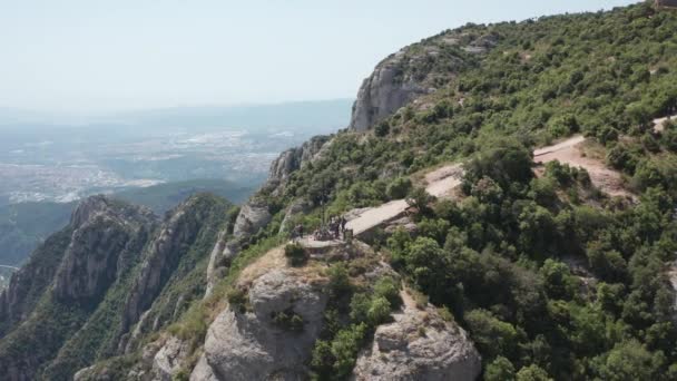 Drone flight over rock with cross of Saint Michael — Stock Video