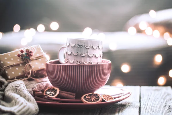 still life with home Christmas decor in the living room on a wooden table, the concept of celebration and home comfort