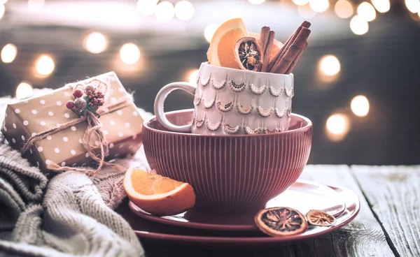 still life with home Christmas decor in the living room on a wooden table, the concept of celebration and home comfort