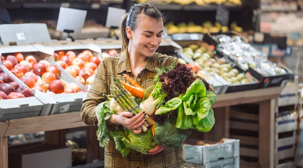 Woman in the supermarket. Beautiful young woman shopping in a su