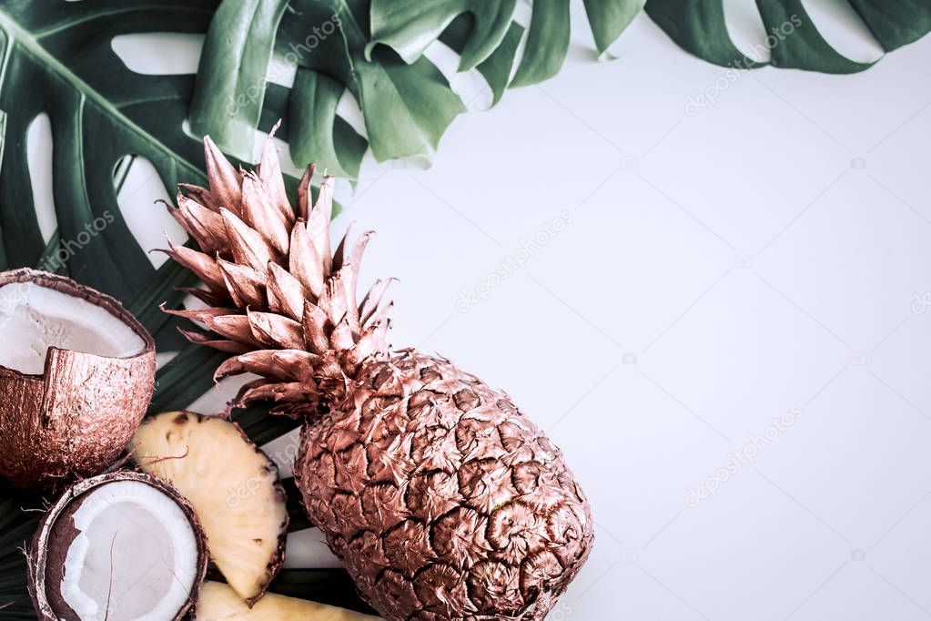 summer composition with tropical leaves and fruits on white back
