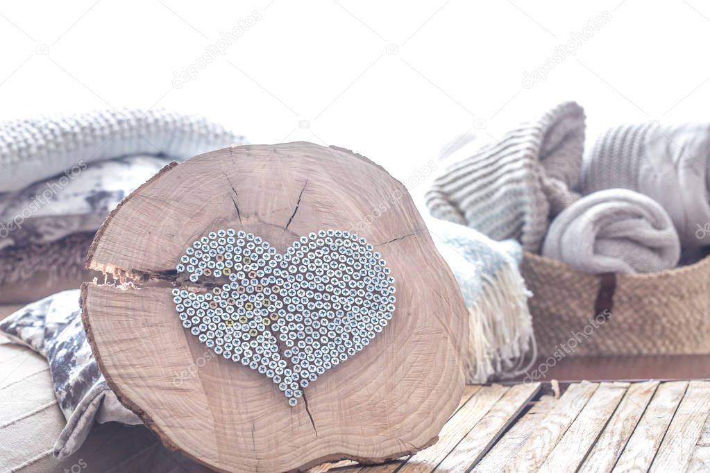 Heart on a wooden background in the interior of the room