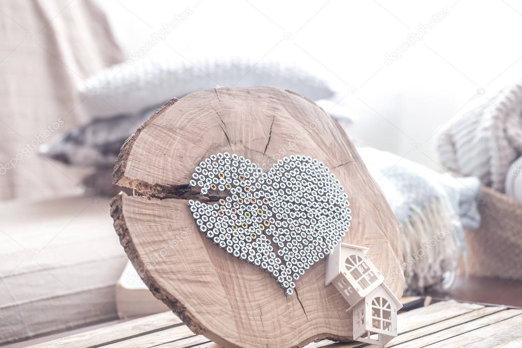 Heart on a wooden background in the interior of the room