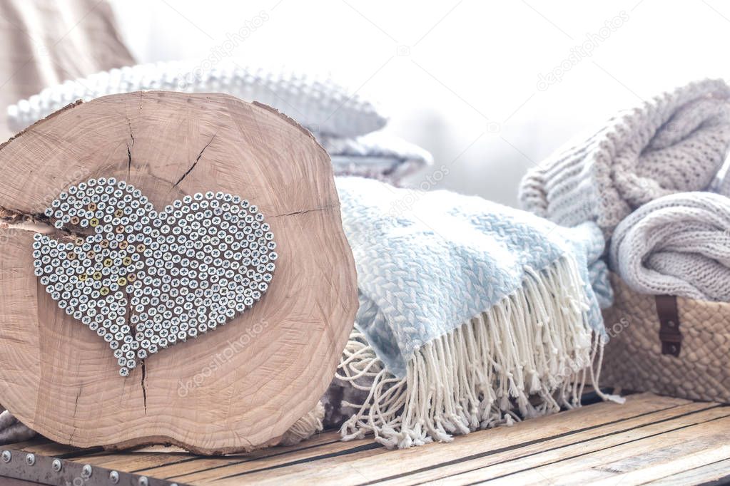 Heart on a wooden background in the interior of the room