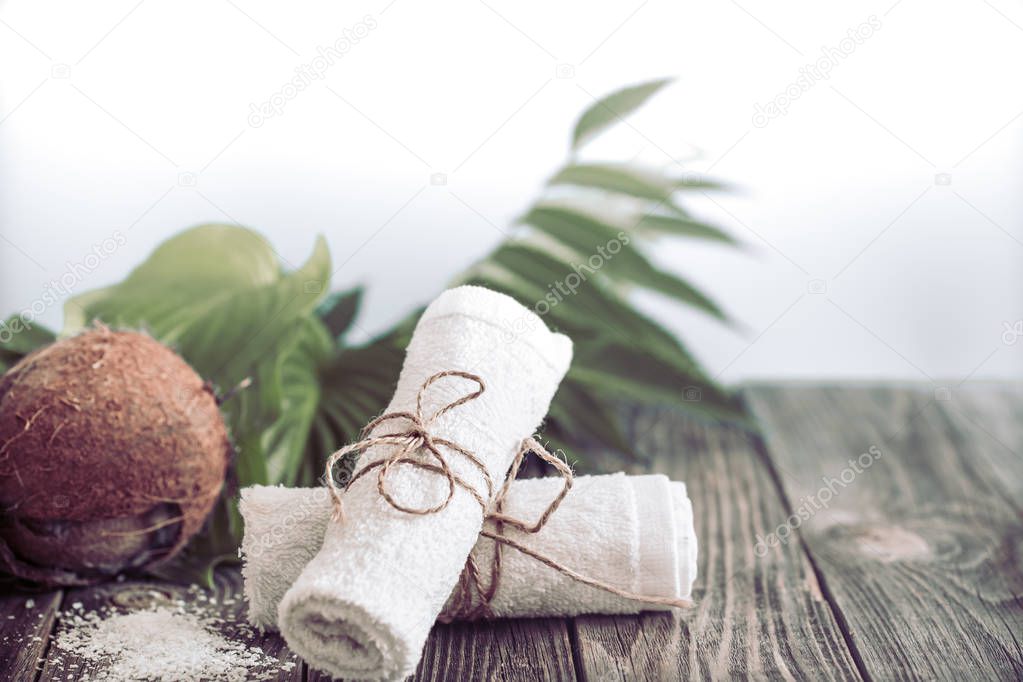 Spa and wellness setting with flowers and towels. Dayspa nature products with coconut