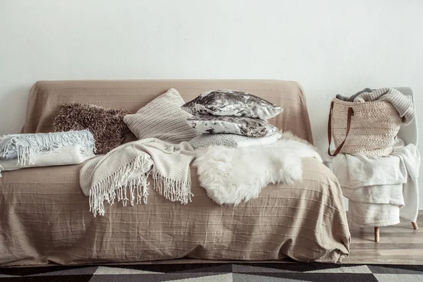 interior of the living room with a sofa and decorative items .