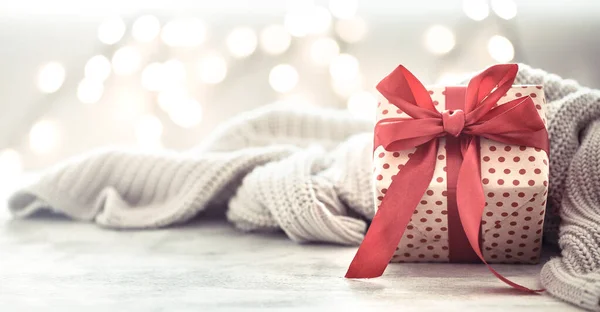 Background holiday, gift in a beautiful box with a red bow . — Stock Photo, Image