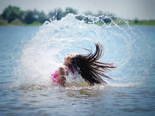 Girl Splashing River Water Her Hair Royalty Free Stock Photos