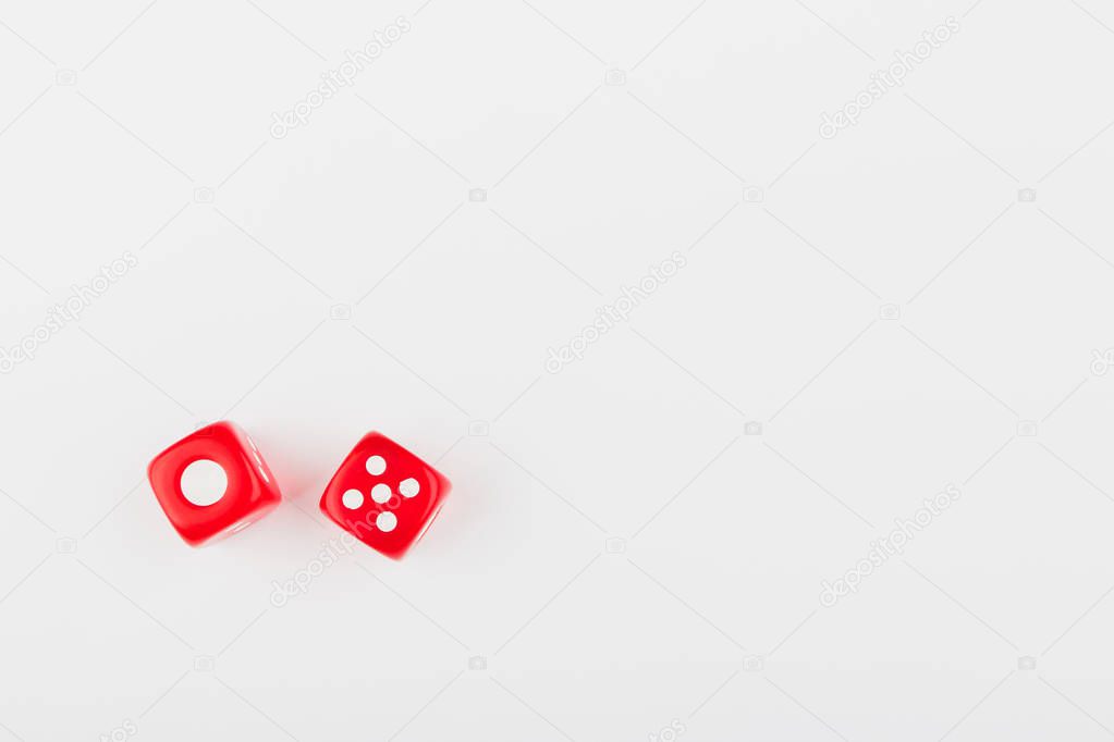 Pair of red dice with number one and five, on the light background