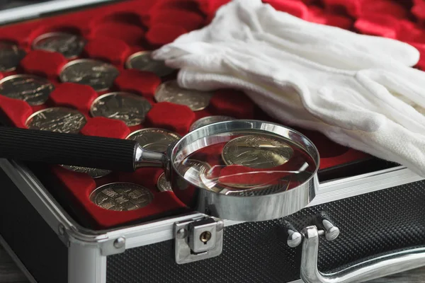 Different Coins Box Magnifying Glass White Gloves Soft Focus Background — Stock Photo, Image