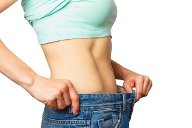 Sıska güzel kadın büyük beden kot pantolon giyiyor, diyet ve sağlık konsepti, izole edilmiş.