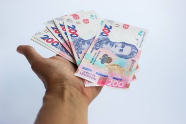 Elinde 200 hryvnias, iş konsepti.