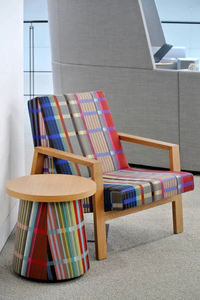multicolored armchair in fabric and wood
