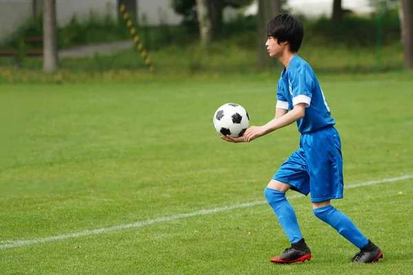 throwing ball in soccer game