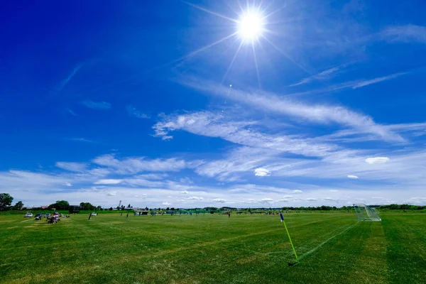 soccer ground and blue sky