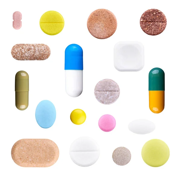 Set aus verschiedenen bunten Pillen und Kapseln isoliert auf weißem b lizenzfreie Stockfotos