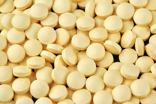 Närbild foto av många gula piller. Medicin — Stockfoto