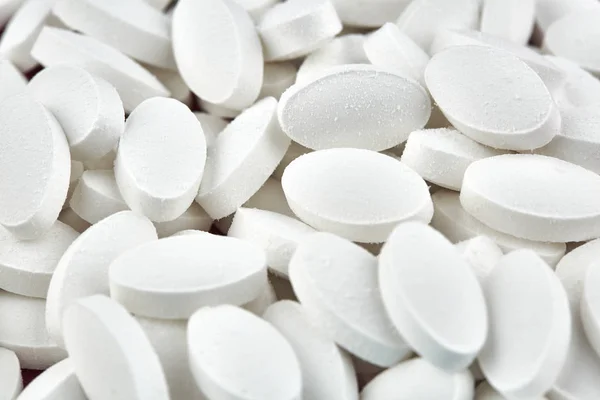 Närbild foto av små vita piller. Medicin — Stockfoto