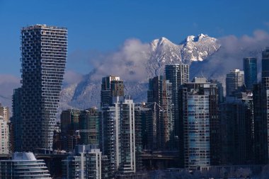 View of Vancouver and Grouse Mountain under the snow. Winter day in Vancouver. British Columbia. Canada. clipart