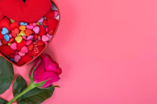 Many small heart in heart box with pink roses on pink color background