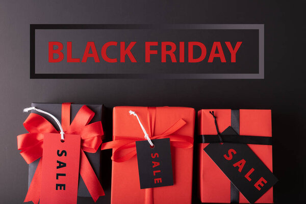 Black Friday sale concept. Red Sale tag  and Black Sale tag color on the black background with Copy space. Black Friday weekend