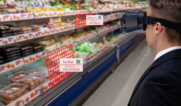smart retail concept, A stores manager can check what data of real time insights into shelf status which report on a tablet from artificial intelligence (ai) smart glasses while scanning goods, price