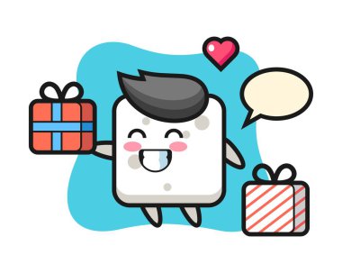 Şeker küpü maskot çizgi filmi hediyeyi veriyor.